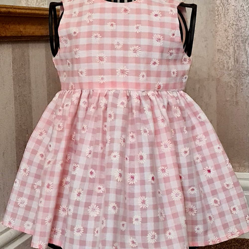 <p>This cute little dress is handmade, the top is fully lined with button opening at the back.</p>
