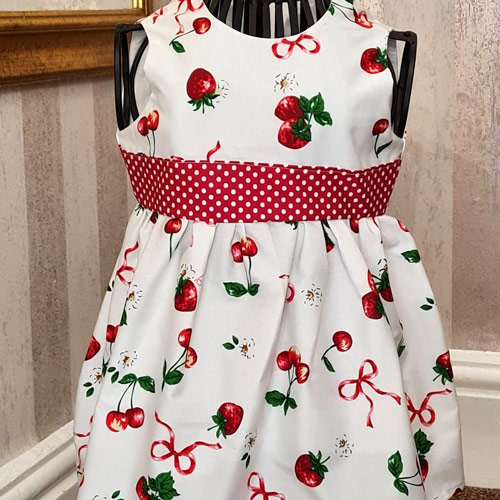 <p>This cute little dress is handmade, the top is fully lined with button opening at the back.</p>
